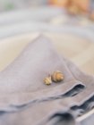 Two acorns on napkin — Stock Photo