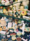 Figurines on counter at antique shop — Stock Photo
