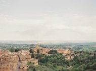 Siena with green hills on background — Stock Photo