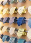 Colorful neckties at shop rails — Stock Photo