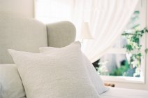 Big bed with pillows — Stock Photo