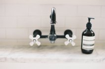 Black tap with white faucet — Stock Photo