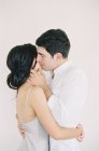 Beautiful couple hugging and kissing — Stock Photo