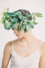 Woman in large floral crown — Stock Photo