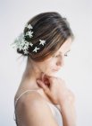 Woman with flowers in hair — Stock Photo