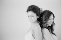 Woman in wedding dress with friend — Stock Photo