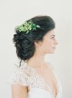 Woman in wedding dress with hair decoration — Stock Photo