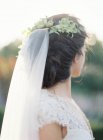 Young bride standing outdoors — Stock Photo