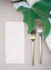 Forks with piece of paper — Stock Photo