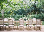 Wedding table with chairs outdoors — Stock Photo