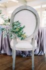 Chair decorated with branch — Stock Photo