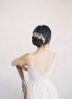 Young bride wearing bridal gown — Stock Photo