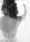 Bride choosing wedding dresses — Stock Photo