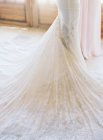 Bride standing in wedding dress — Stock Photo