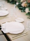 Plate with napkin and tableware — Stock Photo