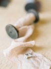 Elegant wedding rings on wrapping fabric — Stock Photo