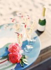 Glasses of champagne on tray — Stock Photo