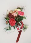 Beautiful bouquet tied with red ribbon — Stock Photo