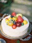 Cake decorated with fresh fruits — Stock Photo