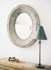 Vintage wooden mirror and lamp — Stock Photo