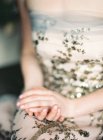 Young woman in decorated dress — Stock Photo