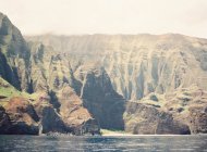 Volcanic island with mountain ridges — Stock Photo