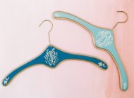 Blue hangers with letters inscriptions — Stock Photo