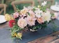 Fresh bouquet on setting table — Stock Photo
