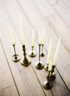 Wax candles in elegant candle holders — Stock Photo