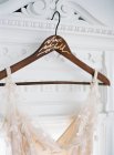 Bridal dress hanging — Stock Photo