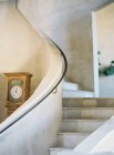Curve of stairs with clock — Stock Photo