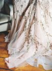 Wedding dress decorated with spangles — Stock Photo