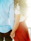 Young couple holding hands — Stock Photo