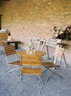 Garden wooden table and chairs — Stock Photo