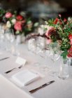 Flower bouquets on set table — Stock Photo