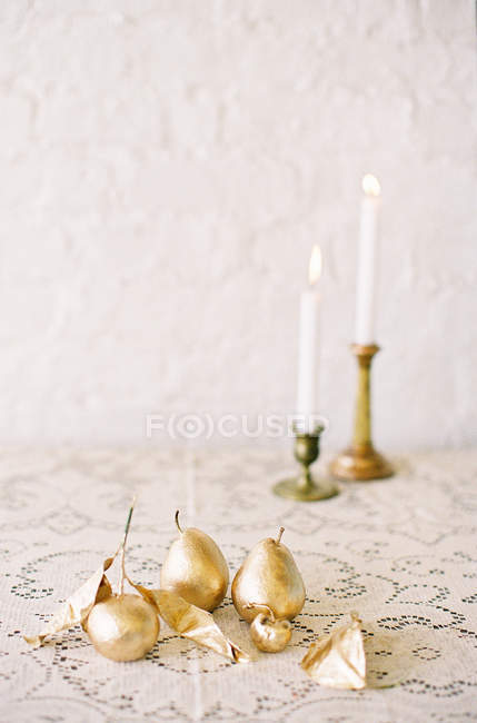 Golden ornamental pears with leaves — Stock Photo