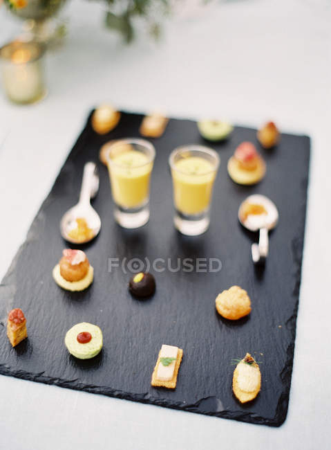 Small desserts with fruit cocktail shots — Stock Photo