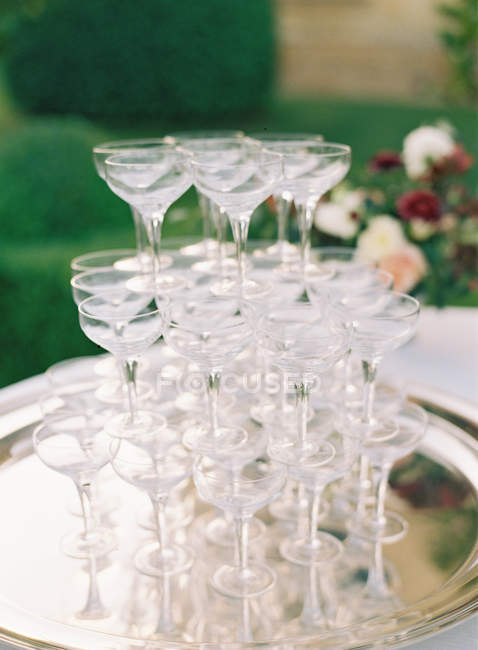 Pile of cocktail glasses on tray — Stock Photo