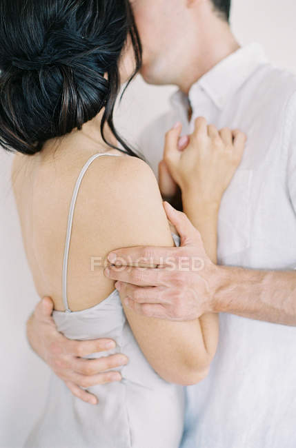 Young couple cuddling and kissing — Stock Photo