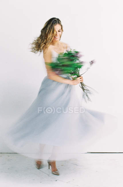 Woman in tulle dress turning around — Stock Photo
