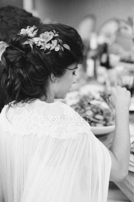 Bride sitting at wedding table — Stock Photo