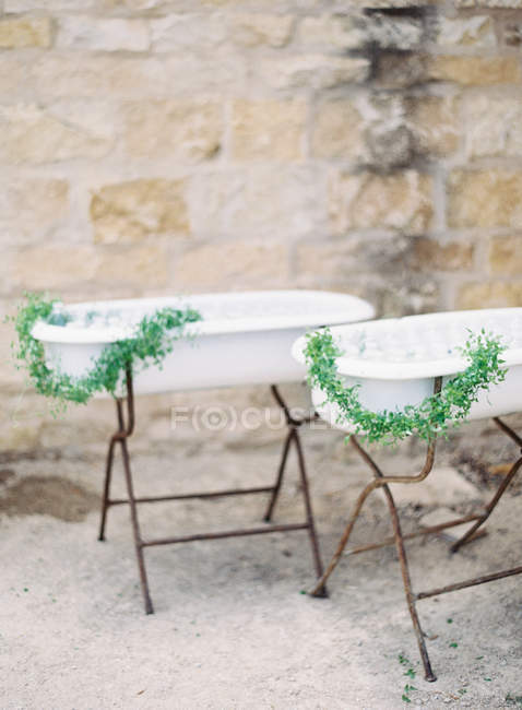 Bathes with ice and bottles of water set outdoor — Stock Photo
