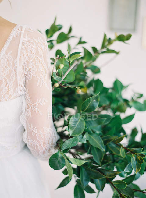 Bride with floral bouquet — Stock Photo