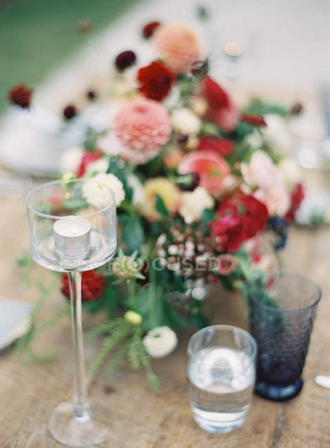 Fresh cut bouquet and glasses — Stock Photo