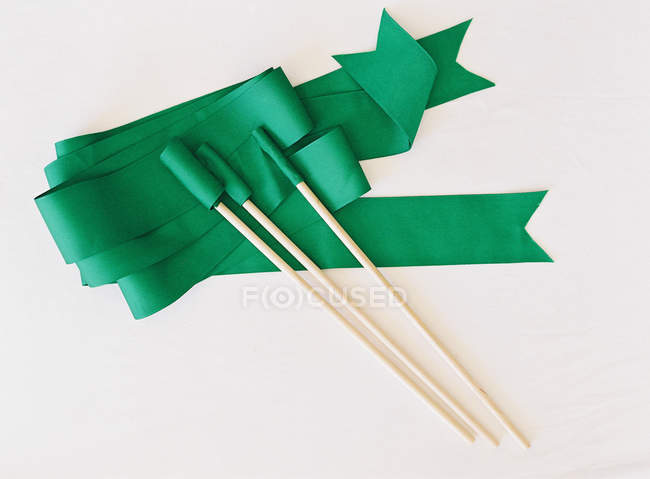 Green ribbon wands — Stock Photo