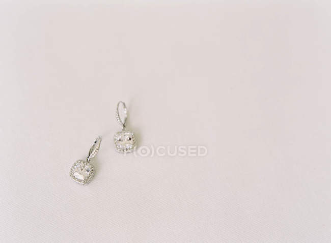 Precious earrings with gems — Stock Photo
