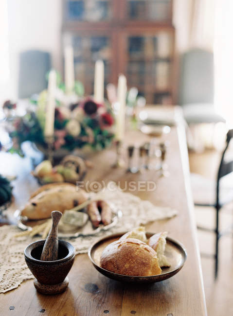 Food on rustic dinner setting table — Stock Photo