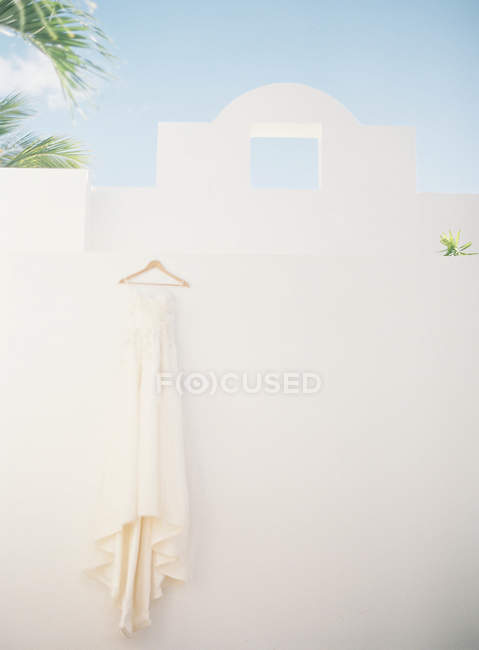 Wedding dress hanging — Stock Photo