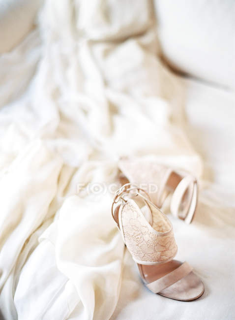 Wedding dress and shoes — Stock Photo