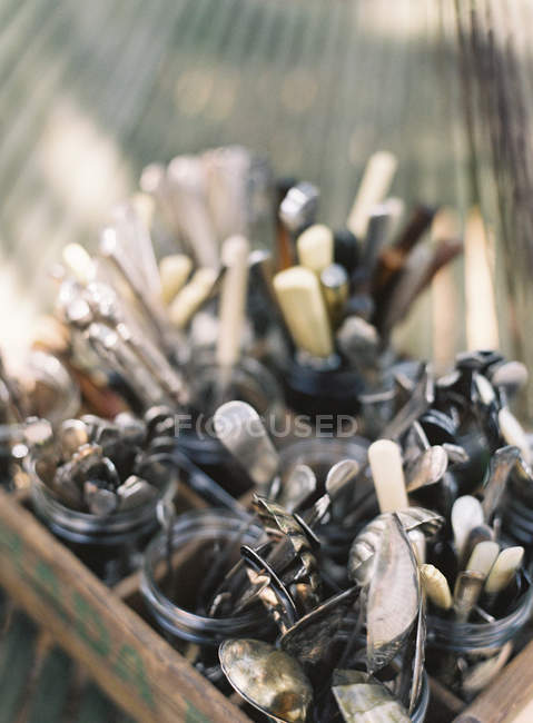 Metal cutlery in jars — Stock Photo